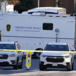 
              A Virginia State Police crime scene investigation truck is on the scene of an overnight shooting at the University of Virginia, Monday, Nov. 14, 2022, in Charlottesville. Va. (AP Photo/Steve Helber)
            