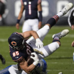 
              Chicago Bears tight end Cole Kmet (85) is brought down by Detroit Lions safety Kerby Joseph after a nine-yard reception during the first half of an NFL football game in Chicago, Sunday, Nov. 13, 2022. (AP Photo/Charles Rex Arbogast)
            