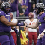 
              TCU quarterback Max Duggan (15) and offensive tackle Brandon Coleman (77) celebrate a touchdown during the first half of an NCAA college football game against Iowa State in Fort Worth, Texas, Saturday, Nov. 26, 2022. (AP Photo/LM Otero)
            