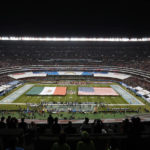 
              FILE -  The flags of Mexico and the United States cover the field before an NFL football game between the Los Angeles Chargers and the Kansas City Chiefs Monday, Nov. 18, 2019, in Mexico City. The NFL returns to Mexico City on Monday, Nov. 21, 2022, when Arizona Cardinals play the San Francisco 49ers. (AP Photo/Eduardo Verdugo, File)
            