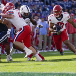 
              Liberty running back Malik Caper (23) runs the ball during the first half of an NCAA college football game against against Connecticut in East Hartford, Conn., Saturday, Nov. 12, 2022. (AP Photo /Bryan Woolston)
            