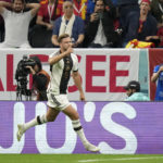 
              Germany's Niclas Fuellkrug celebrates after scoring his side's first goal during the World Cup group E soccer match between Spain and Germany, at the Al Bayt Stadium in Al Khor , Qatar, Sunday, Nov. 27, 2022. (AP Photo/Matthias Schrader)
            