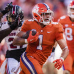 
              Clemson running back Will Shipley (1) runs for a touchdown while pursued by South Carolina defensive back Cam Smith (9) in the second half of an NCAA college football game on Saturday, Nov. 26, 2022, in Clemson, S.C. (AP Photo/Jacob Kupferman)
            