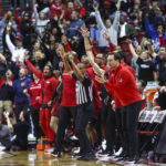 
              UNLV head coach Kevin Kruger claps as fans and staff cheer during the second half of an NCAA college basketball game against Dayton Tuesday, Nov. 15, 2022, in Las Vegas. (AP Photo/Chase Stevens)
            