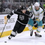 
              San Jose Sharks defenseman Matt Benning (5) vies for the puck against Los Angeles Kings left wing Trevor Moore (12) during the second period of an NHL hockey game Friday, Nov. 25, 2022, in San Jose, Calif. (AP Photo/Tony Avelar)
            