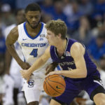 
              Creighton's Shereef Mitchell, left, guards against Holy Cross' Will Batchelder during the first half of an NCAA college basketball game on Monday, Nov. 14, 2022, in Omaha, Neb. (AP Photo/Rebecca S. Gratz)
            