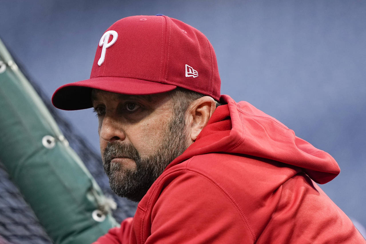 Philadelphia Phillies hitting coach Kevin Long watches during batting practice before Game 4 of bas...