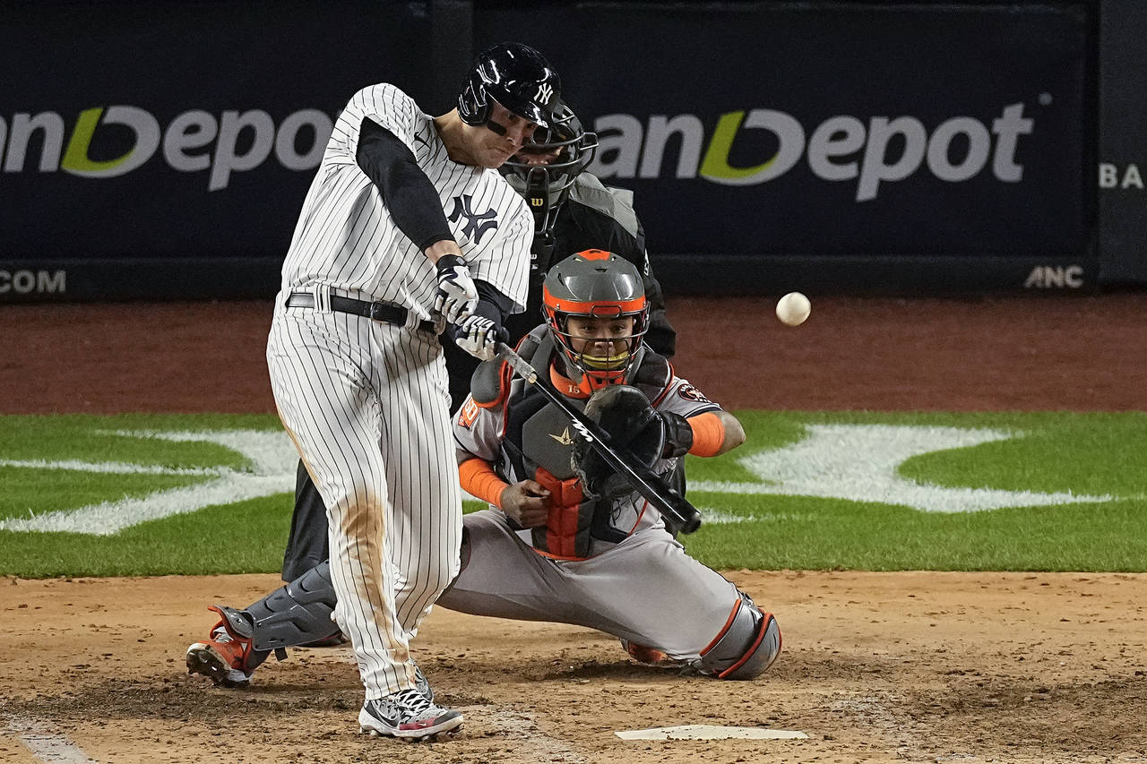 New York Yankees Anthony Rizzo connects for an RBI base hit against the Houston Astros during the f...