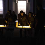 
              People hand out electric candles before a vigil in response to shootings that happened the night before on the University of Virginia campus in Charlottesville, Va., Monday, Nov. 14, 2022. (Mike Kropf/The Daily Progress via AP)
            