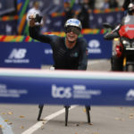 
              Marcel Hug of Switzerland celebrates before crossing the finish line first in the men's wheelchair division of the New York City Marathon, Sunday, Nov. 6, 2022, in New York. (AP Photo/Jason DeCrow)
            