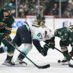 
              Seattle Kraken center Morgan Geekie (67) and Minnesota Wild center Mason Shaw (58), right, battle for the puck during the second period of an NHL hockey game Thursday, Nov. 3, 2022, in St. Paul, Minn. (AP Photo/Abbie Parr)
            