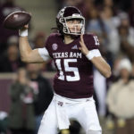 
              Texas A&M quarterback Conner Weigman (15) looks for a receiver during the first quarter of the team's NCAA college football game against LSU on Saturday, Nov. 26, 2022, in College Station, Texas. (AP Photo/Sam Craft)
            