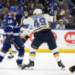 
              St. Louis Blues center Ivan Barbashev (49) and Tampa Bay Lightning right wing Corey Perry (10) fight during the first period of an NHL hockey game Friday, Nov. 25, 2022, in Tampa, Fla. (AP Photo/Chris O'Meara)
            