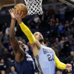 
              Memphis Grizzlies forward Dillon Brooks (24) shoots in front of Minnesota Timberwolves guard Anthony Edwards (1) in the first quarter of an NBA basketball game Wednesday, Nov. 30, 2022, in Minneapolis. (AP Photo/Andy Clayton-King)
            