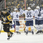 
              Pittsburgh Penguins center Sidney Crosby (87) skates away as the Toronto Maple Leafs celebrate a goal by right wing William Nylander during the second period of an NHL hockey game, Saturday, Nov. 26, 2022, in Pittsburgh. (AP Photo/Philip G. Pavely)
            
