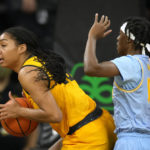 
              Iowa forward Hannah Stuelke grabs a rebound in front of Southern guard Soniyah Reed (14) during the second half of an NCAA college basketball game, Monday, Nov. 7, 2022, in Iowa City, Iowa. (AP Photo/Charlie Neibergall)
            