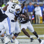 
              Duke's Jaquez Moore carries the ball during the first half of an NCAA college football game against Wake Forest in Durham, N.C., Saturday, Nov. 26, 2022. (AP Photo/Ben McKeown)
            