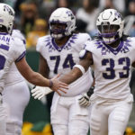 
              TCU running back Kendre Miller (33) is congratulated by quarterback Max Duggan (15) after Miller scored a touchdown during the first half of an NCAA college football game against Baylor in Waco, Texas, Saturday, Nov. 19, 2022. (AP Photo/LM Otero)
            