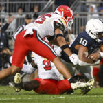 
              Penn State running back Nicholas Singleton (10) scores a touchdown past Maryland defenders Deonte Banks (3) and Beau Brade (25) during the first half of an NCAA college football game, Saturday, Nov. 12, 2022, in State College, Pa. (AP Photo/Barry Reeger)
            