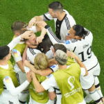 
              Germany's Niclas Fuellkrug, top centre, celebrates with teammates after scoring his side's first goal during the World Cup group E soccer match between Spain and Germany, at the Al Bayt Stadium in Al Khor , Qatar, Sunday, Nov. 27, 2022. (AP Photo/Petr David Josek)
            