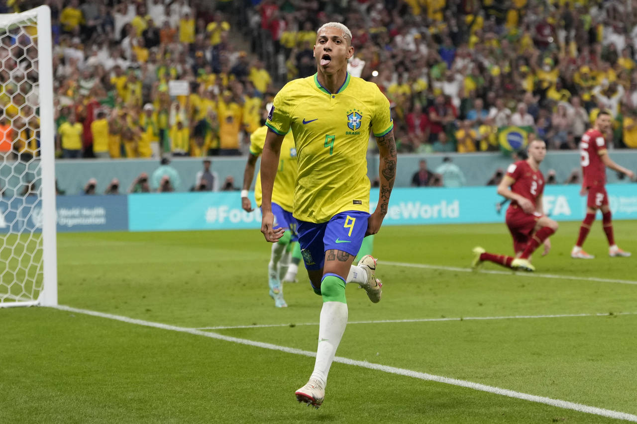 Brazil's Richarlison celebrates after scoring the opening goal during the World Cup group G soccer ...