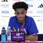 
              Tyler Adams of the United States attends a press conference on the eve of the group B World Cup soccer match between England and the United States, in Doha, Qatar, Thursday, Nov. 24, 2022. (AP Photo/Ashley Landis)
            