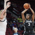 
              UConn forward Aaliyah Edwards, right, shoots over Iowa forward Monika Czinano during the first half of an NCAA college basketball game in the Phil Knight Legacy Championship in Portland, Ore., Sunday, Nov. 27, 2022. (AP Photo/Craig Mitchelldyer)
            