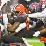 
              Cleveland Browns running back Nick Chubb (24) scores a touchdown in overtime of the team's NFL football game against the Tampa Bay Buccaneers in Cleveland, Sunday, Nov. 27, 2022. The Browns won 23-17. (AP Photo/David Richard)
            