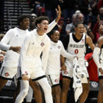 
              San Diego State players celebrate during the second half of the team's NCAA college basketball game against BYU on Friday, Nov. 11, 2022, in San Diego. (AP Photo/Denis Poroy)
            