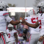 
              Ohio State wide receiver Emeka Egbuka, right, celebrates with quarterback C.J. Stroud after scoring a touchdown against Northwestern during the first half of an NCAA college football game, Saturday, Nov. 5, 2022, in Evanston, Ill. (AP Photo/Nam Y. Huh)
            