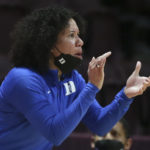 
              FILE - Duke head coach Kara Lawson gives instructions to her team during the first half of an NCAA college basketball game against Virginia Tech, Thursday, Dec. 30, 2021 in Blacksburg Va.  The Atlantic Coast and Southeastern conferences have led the way among the power conferences in hiring coaches of color to lead women’s basketball programs. (Matt Gentry/The Roanoke Times via AP, File)
            