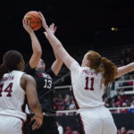 
              Stanford forward Ashten Prechtel (11) blocks a shot by Cal State Northridge center Rochelle Fourie (13) during the first half of an NCAA college basketball game in Stanford, Calif., Wednesday, Nov. 9, 2022. (AP Photo/Godofredo A. Vásquez)
            