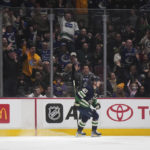 
              Vancouver Canucks' Elias Pettersson, of Sweden, celebrates his second goal of the night against the Los Angeles Kings, during the second period of an NHL hockey game Friday, Nov. 18, 2022, in Vancouver, British Columbia. (Darryl Dyck/The Canadian Press via AP)
            