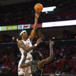 
              Maryland forward Julian Reese shoots the ball over Coppin State forward Justin Winston (35) during the first half of an NCAA basketball game, Friday, Nov. 25, 2022, in College Park, Md. (AP Photo/Terrance Williams)
            
