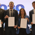 
              Sports Ministers, from left, Uruguay's Sebastian Bauza, Argentina's Matias Lammens, Chile's Alexandra Benado and Paraguay's Diego Galeano hold up documents they signed at the National Stadium to create the "Corporation Juntos 2030," the organization that will create their joint-bid to host the 2030 World Cup soccer tournament, in Santiago, Chile, Friday, Nov. 11, 2022. (AP Photo/Esteban Felix)
            