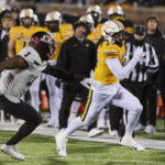 
              Missouri tight end Ryan Hoerstkamp, right, runs past New Mexico State linebacker Chris Ojoh, left, on the way to a touchdown during the second quarter of an NCAA college football game Saturday, Nov. 19, 2022, in Columbia, Mo. (AP Photo/L.G. Patterson)
            