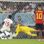 
              Belgium goalkeeper Thibaut Courtois makes a save on a penalty kick from Canada forward Alphonso Davies during the World Cup group F soccer match between Belgium and Canada, at the Ahmad Bin Ali Stadium in Doha, Qatar, Wednesday, Nov. 23, 2022. (Nathan Denette/The Canadian Press via AP)
            