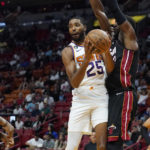 
              Phoenix Suns forward Mikal Bridges (25) looks to pass the ball as Miami Heat center Bam Adebayo (13) defends during the first half of an NBA basketball game Monday, Nov. 14, 2022, in Miami. (AP Photo/Marta Lavandier)
            