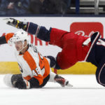 
              Philadelphia Flyers forward Morgan Frost, left, collides with Columbus Blue Jackets forward Gustav Nyquist during the first period an NHL hockey game in Columbus, Ohio, Thursday, Nov. 10, 2022. (AP Photo/Paul Vernon)
            