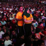 
              Fans watch the World Cup, group A soccer match between Qatar and Ecuador at the fan zone in Doha, Sunday, Nov. 20, 2022. (AP Photo/Petr David Josek)
            