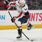 
              Washington Capitals center Lars Eller shoots during the third period of an NHL hockey game against the Detroit Red Wings, Thursday, Nov. 3, 2022, in Detroit. (AP Photo/Carlos Osorio)
            