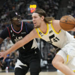 
              Utah Jazz forward Kelly Olynyk (41) drives to the basket as Los Angeles Clippers guard Reggie Jackson (1) defends during the first half of an NBA basketball game Wednesday, Nov. 30, 2022, in Salt Lake City. (AP Photo/Rick Bowmer)
            