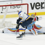 
              St. Louis Blues center Jordan Kyrou (25) scores the game winning goal during overtime of an NHL hockey game against the Florida Panthers, Saturday, Nov. 26, 2022, in Sunrise, Fla. The Blues defeated the Panthers 5-4. (AP Photo/Marta Lavandier)
            