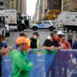 
              New York police cars and dump trucks block 1st Ave. during the New York City Marathon in New York, Sunday, Nov. 6, 2022. (AP Photo/Eduardo Munoz Alvarez)
            