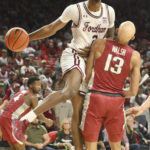 
              Fordham forward Khalid Moore (2) is called for an offensive foul as he tries to get past Arkansas guard Jordan Walsh (13) during the first half of an NCAA college basketball game Friday, Nov. 11, 2022, in Fayetteville, Ark. (AP Photo/Michael Woods)
            