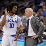 
              UCLA head coach Mick Cronin, right, talks to guard Tyger Campbell (10) during the first half of an NCAA college basketball game Monday, Nov. 7, 2022, in Los Angeles. (AP Photo/Marcio Jose Sanchez)
            