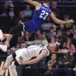 
              Wake Forest's Cameron Hildreth is called for a block as Hampton's Daniel Banister collides with Hildreth during an NCAA college basketball game, Saturday, Nov. 26, 2022,  at Joel Coliseum in Winston-Salem, N.C. (Walt Unks/The Winston-Salem Journal via AP)
            