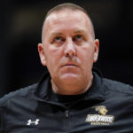 
              Lindenwood coach Kyle Gerdeman looks at the scoreboard during a stoppage in play in the first half of the team's NCAA college basketball game against Dayton, Monday, Nov. 7, 2022, in Dayton, Ohio. (AP Photo/Jeff Dean)
            