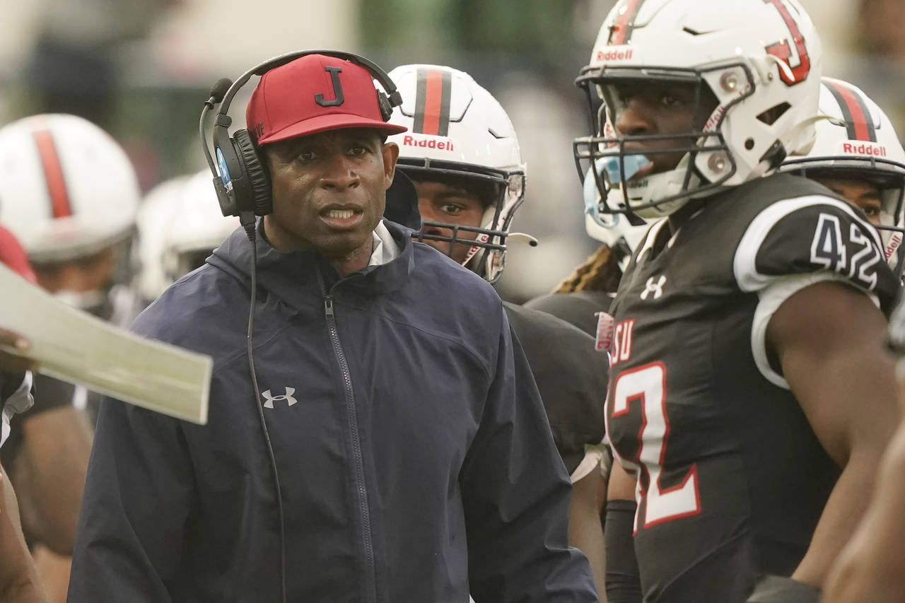Jackson State head coach Deion Sanders glares at his players as they exit the field during the seco...