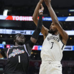 
              Brooklyn Nets forward Kevin Durant (7) shoots over Los Angeles Clippers guard Reggie Jackson (1) during the second half of an NBA basketball game Saturday, Nov. 12, 2022, in Los Angeles. (AP Photo/Marcio Jose Sanchez)
            